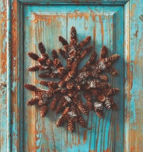 Happy Holidays turquoise door and pinecone wreathe