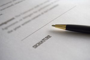 Person signing a contract